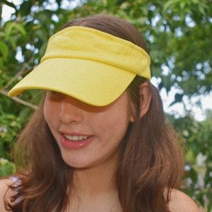 Adjustable yellow tennis visor.